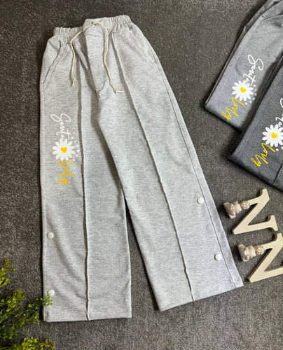 خریدشلوار بگ دخترانه ملانژ زخیم طرح بابونه